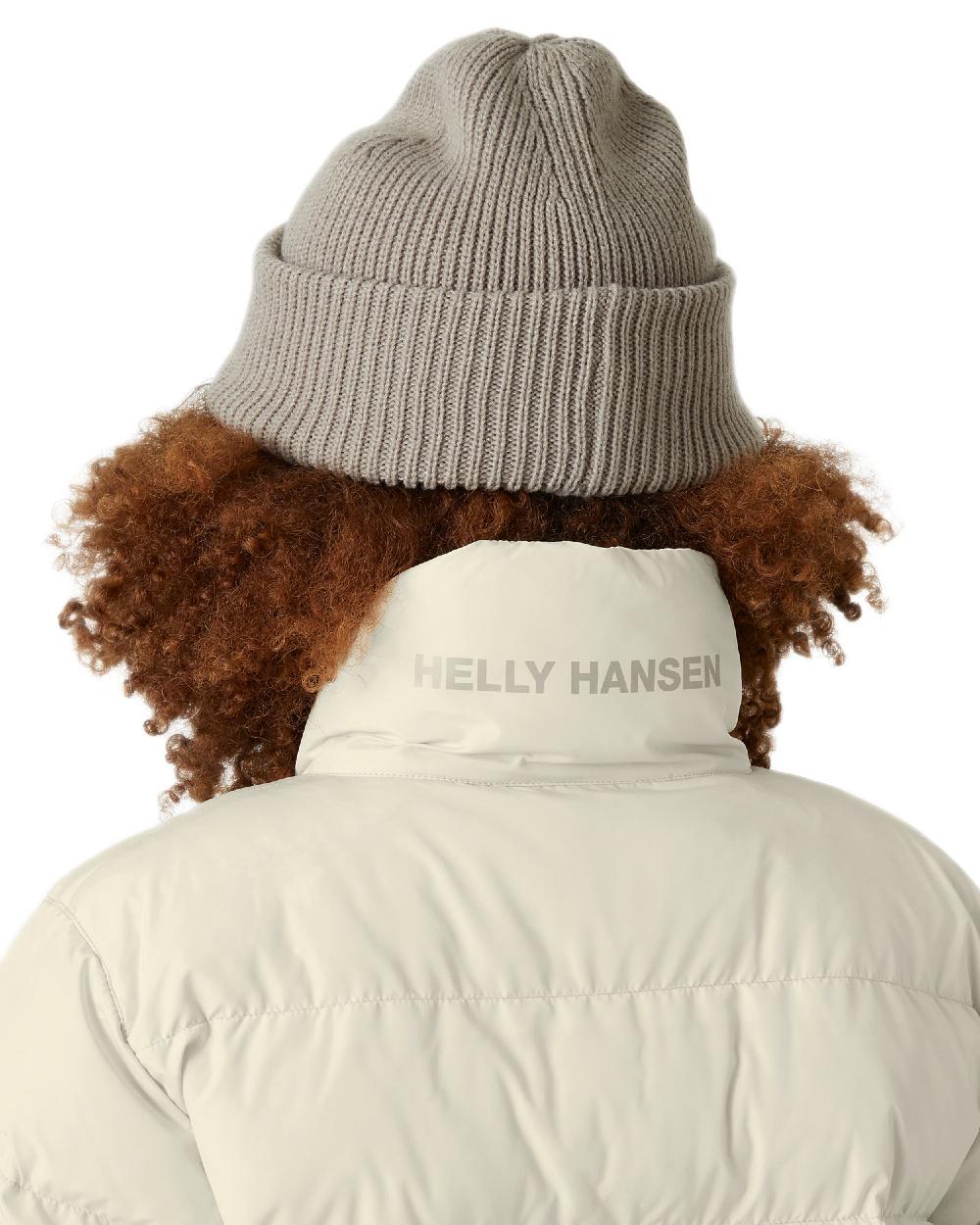 Cream Coloured Helly Hansen Womens YU 23 Reversible Puffer Jacket on white background 