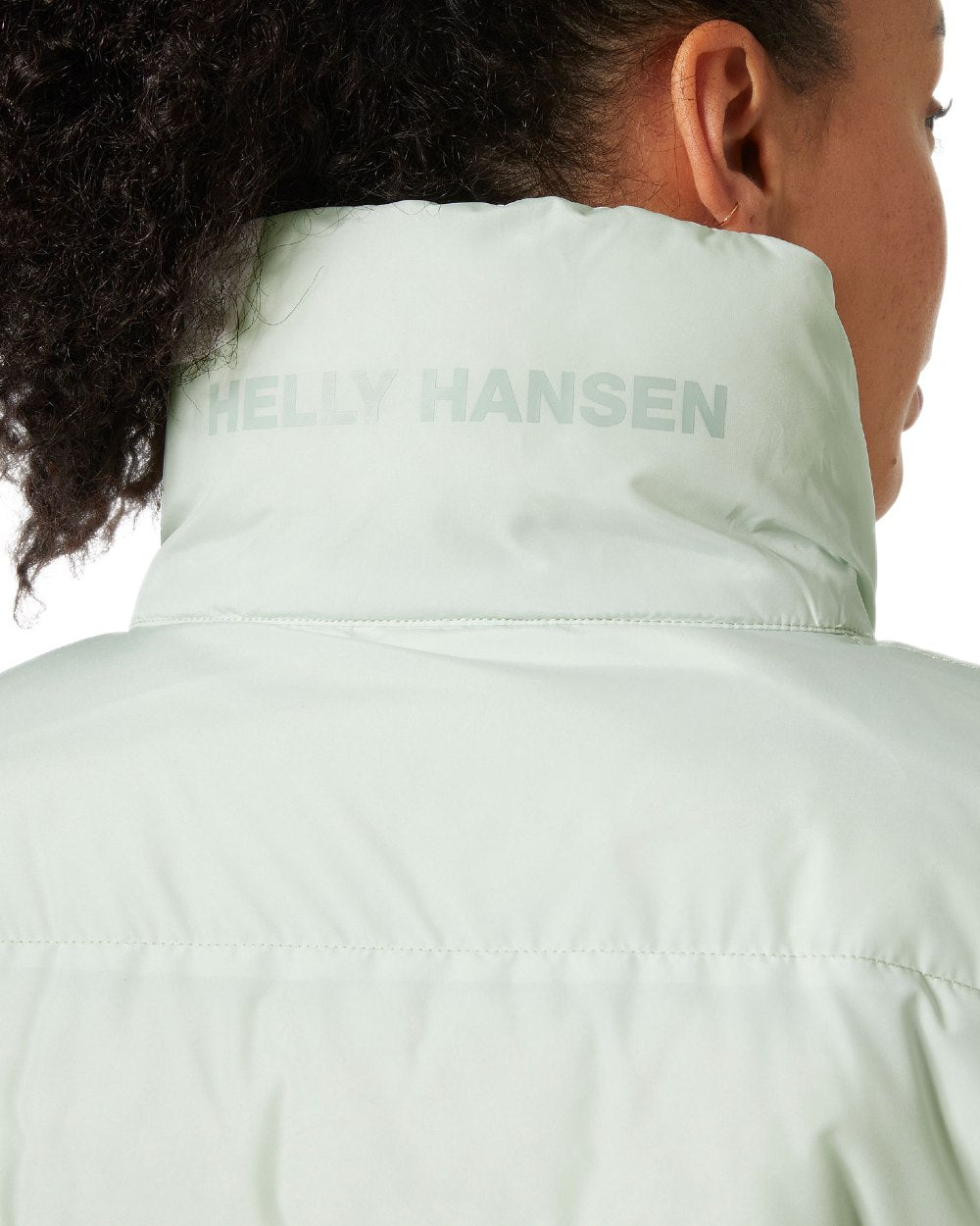 Seafoam Coloured Helly Hansen Womens YU 23 Reversible Puffer Jacket on white background 