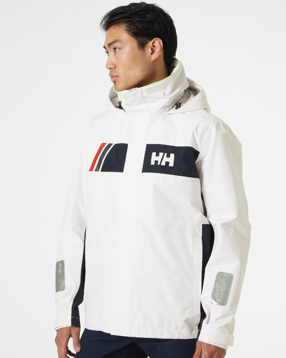 White coloured Helly Hansen Mens Newport Inshore Sailing Jacket on grey background 