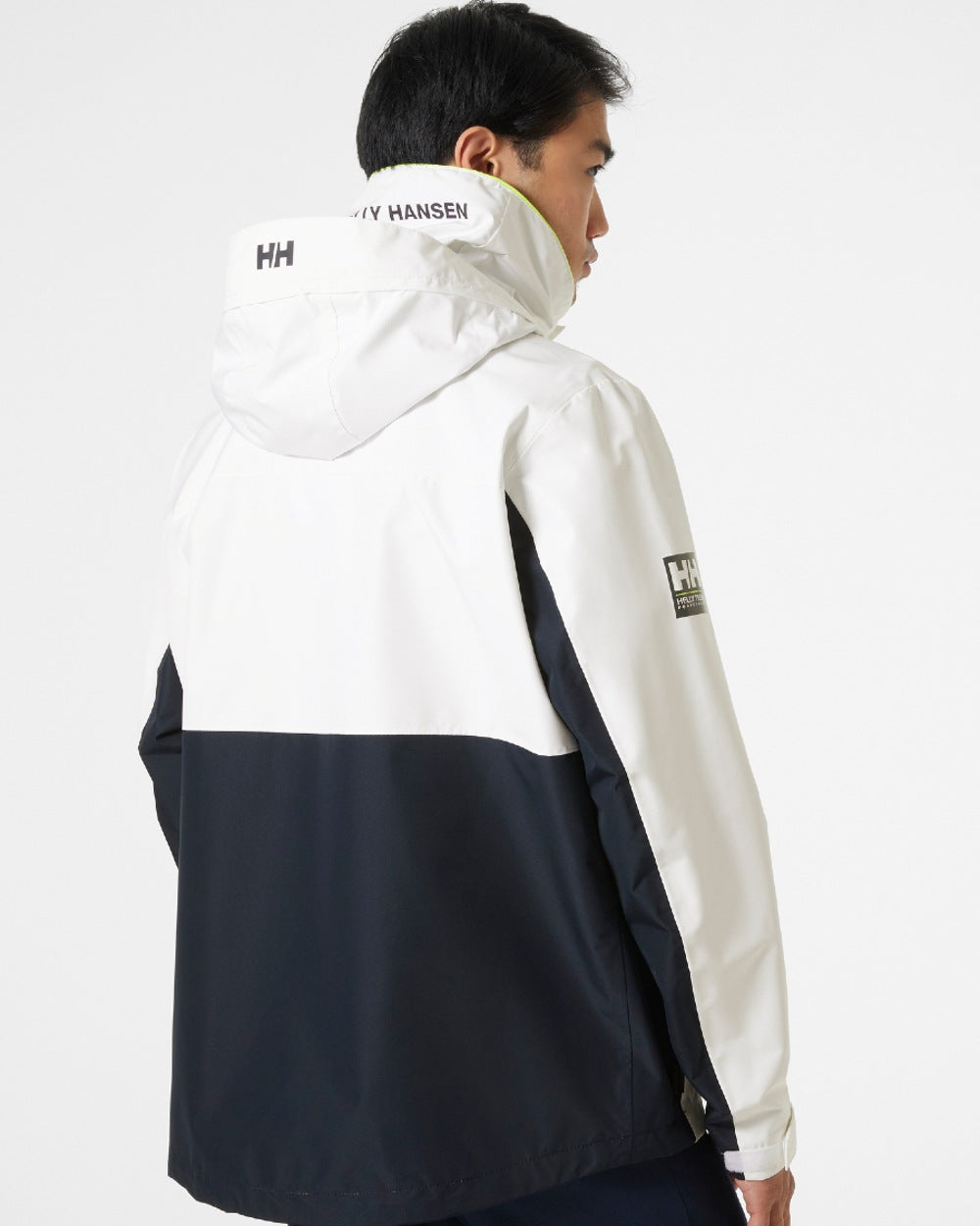 White coloured Helly Hansen Mens Newport Inshore Sailing Jacket on grey background 