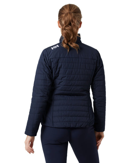 Navy coloured Helly Hansen Womens Crew Insulated Sailing Jacket 2.0 on white background 