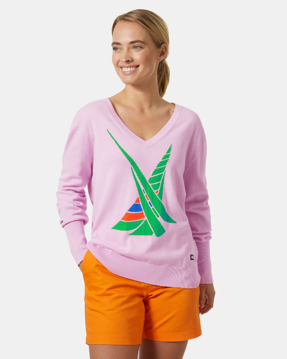 Cherry Blossom coloured Helly Hansen Womens Salt Summer Knit Sweater on grey background 