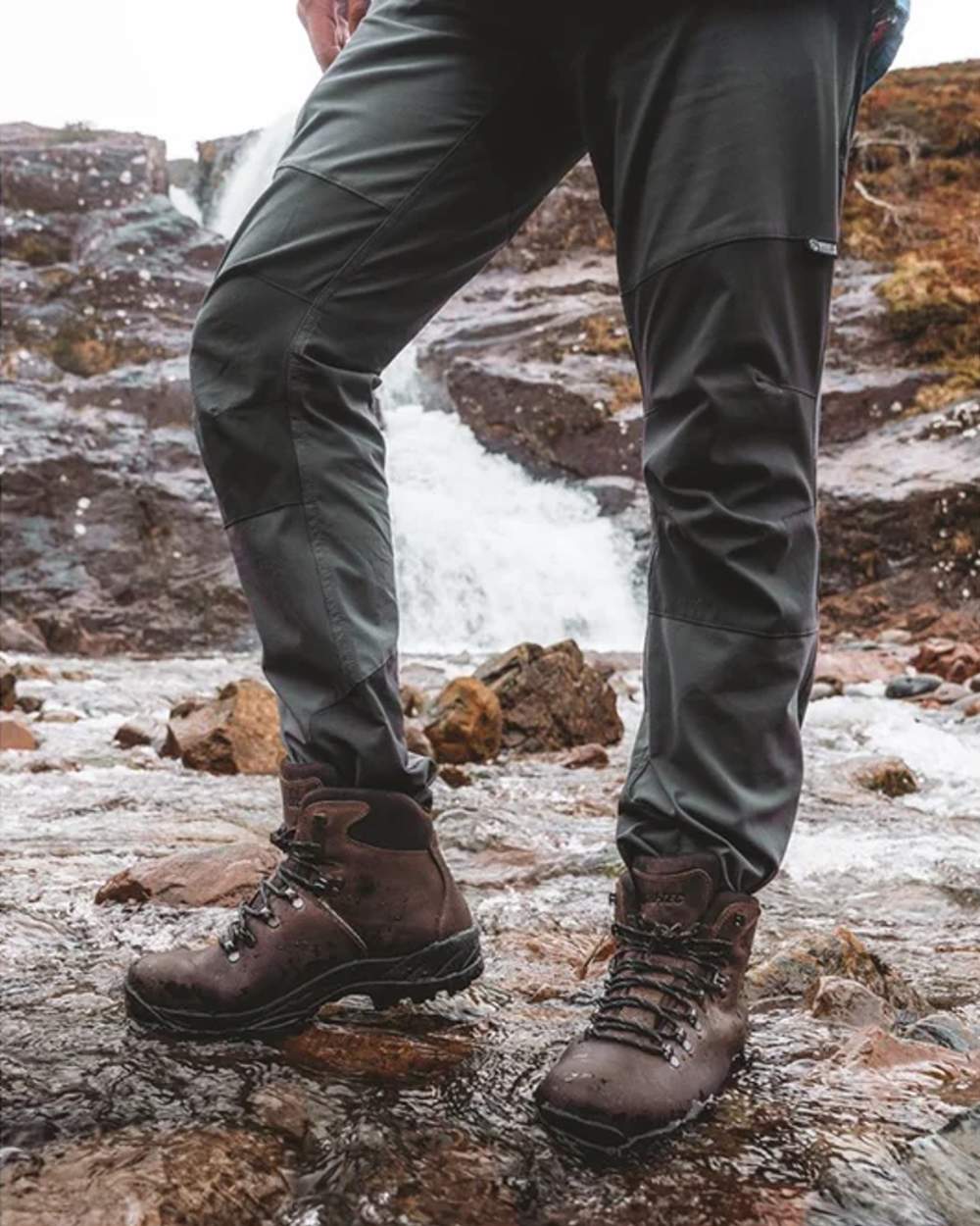 Brown coloured Hi-Tec Ravine Waterproof Hiking Boots on river background