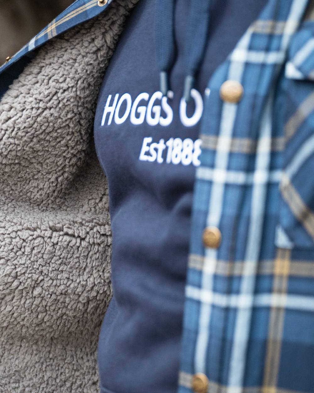 Navy Coloured Hoggs of Fife Annan 1888 Hoodie on countryside background 