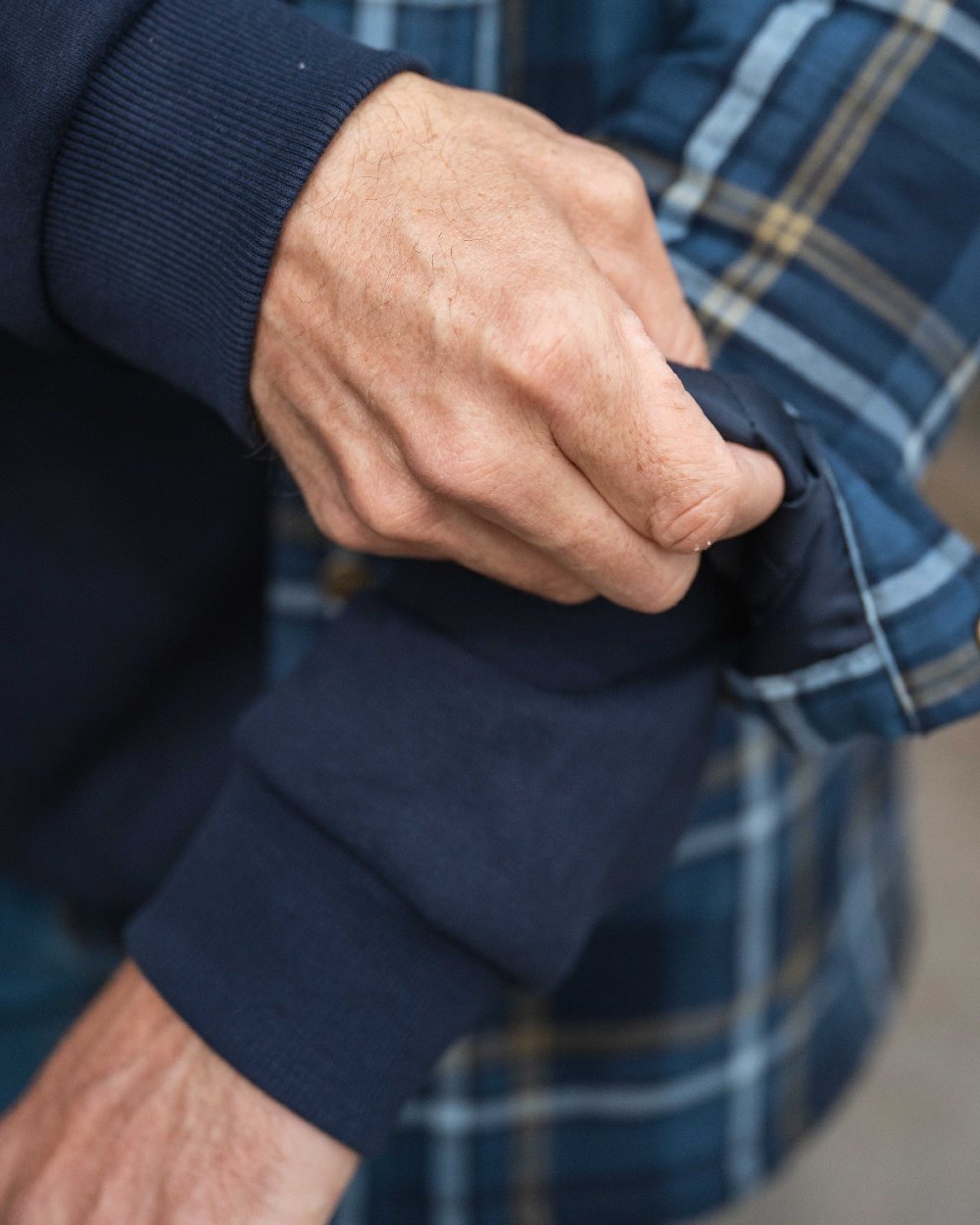 Navy Coloured Hoggs of Fife Annan 1888 Hoodie on countryside background 