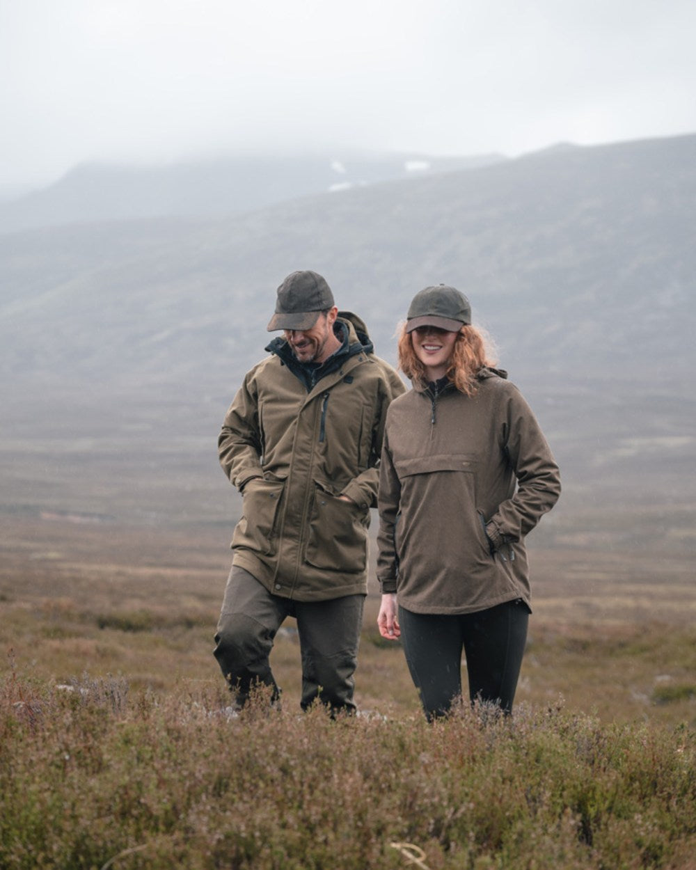 Dark Olive coloured Hoggs of Fife Mens Ardross Pro Waterproof Field Trousers on moorland background 