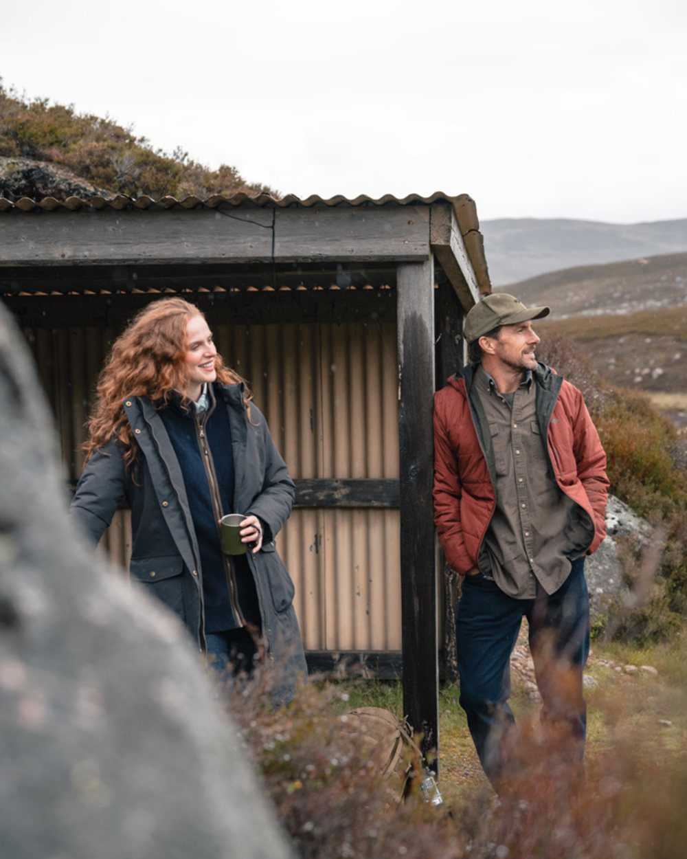 Olive coloured Hoggs of Fife Mens Aviemore Reversible Insulated Jacket on moorland background 