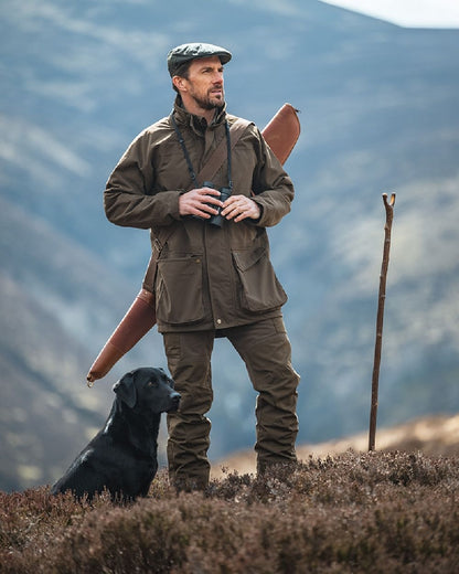 Green Coloured Hoggs of Fife Ballater Waterproof Field Jacket on mountain background 