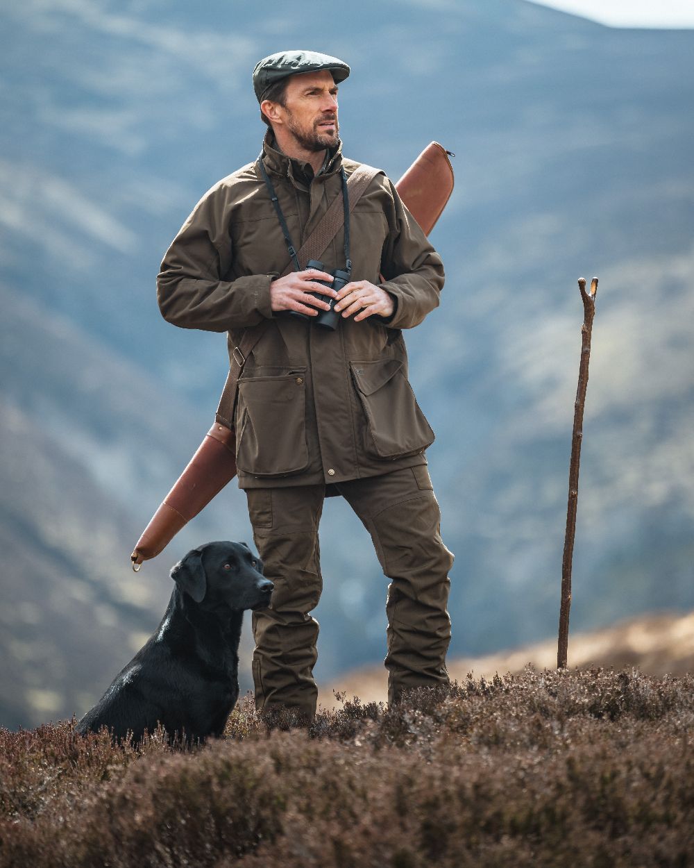 Green Coloured Hoggs of Fife Ballater Waterproof Field Trousers on mountain background 