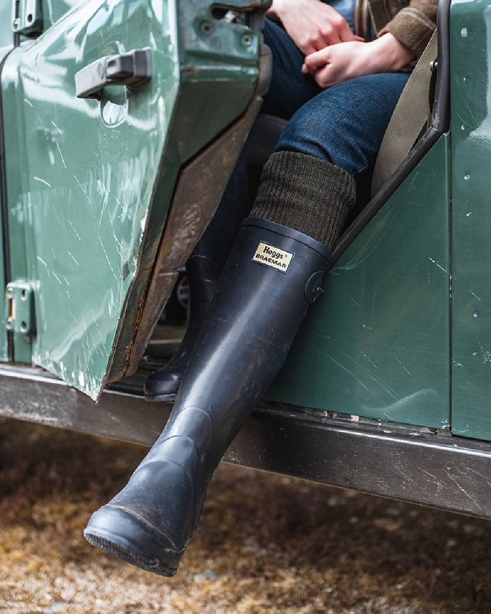 Navy Coloured Hoggs of Fife Braemar Wellingtons on car background 