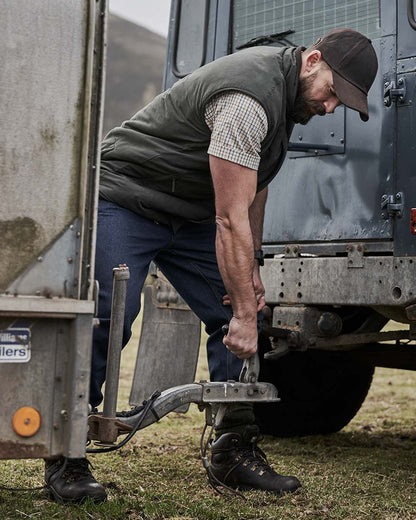 Loden Green Coffee Coloured Hoggs of Fife Breezer II Reversible Bodywarmer on truck background 