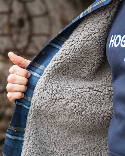Navy Gold Coloured Hoggs of Fife Brunton Fleece Shacket on indoor background 