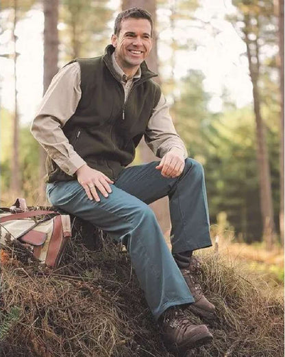 Spruce Coloured Hoggs of Fife Bushwhacker Thermal Stretch Trousers on forest background 