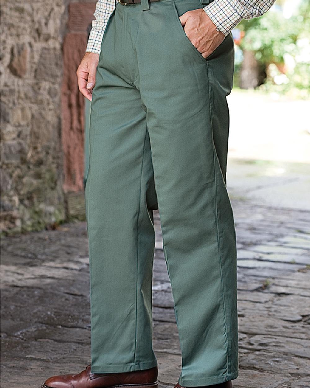 Spruce Coloured Hoggs of Fife Bushwhacker Thermal Stretch Trousers on street background 