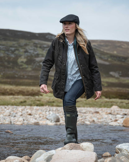 Antique Olive Coloured Hoggs of Fife Caledonia Ladies Antique Wax Jacket on outdoor background 