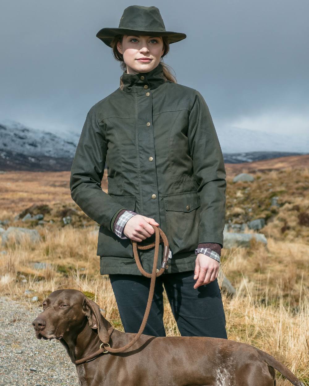 Antique Olive Coloured Hoggs of Fife Caledonia Ladies Antique Wax Jacket on land background 