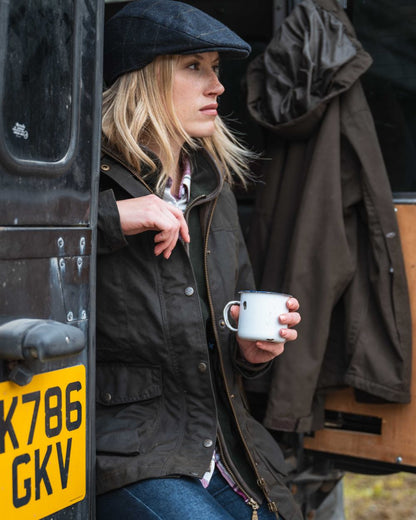 Antique Olive Coloured Hoggs of Fife Caledonia Ladies Antique Wax Jacket on outdoor background 