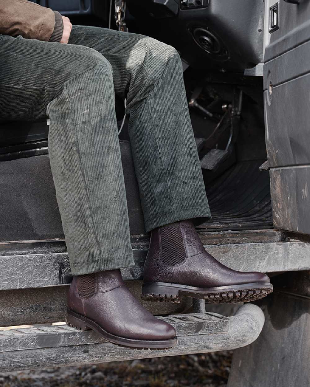 Olive Green Coloured Hoggs of Fife Callander Heavyweight Cord Trousers on car background 