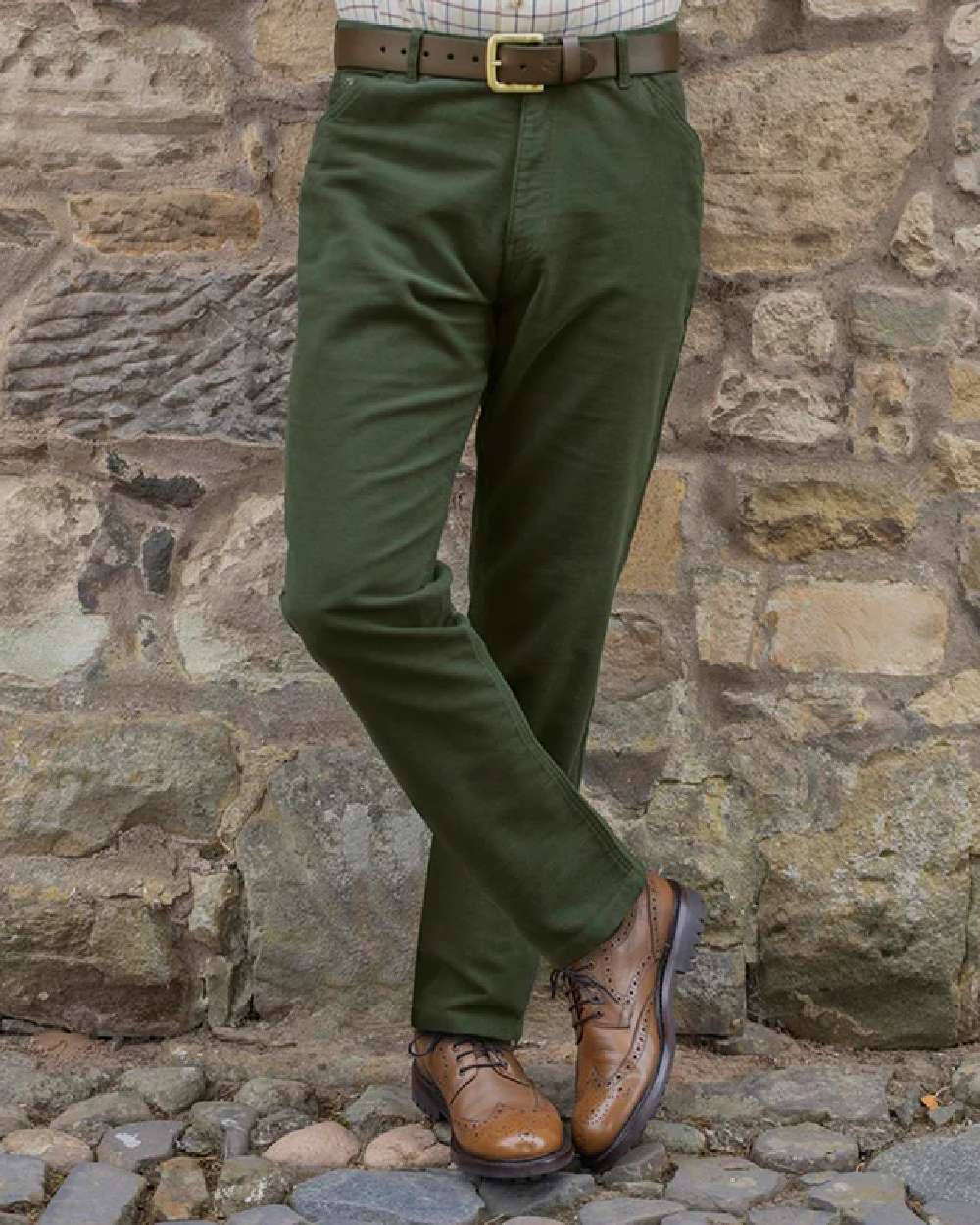 Dark Olive Coloured Hoggs of Fife Carrick Stretch Technical Moleskin Trousers on wall background 