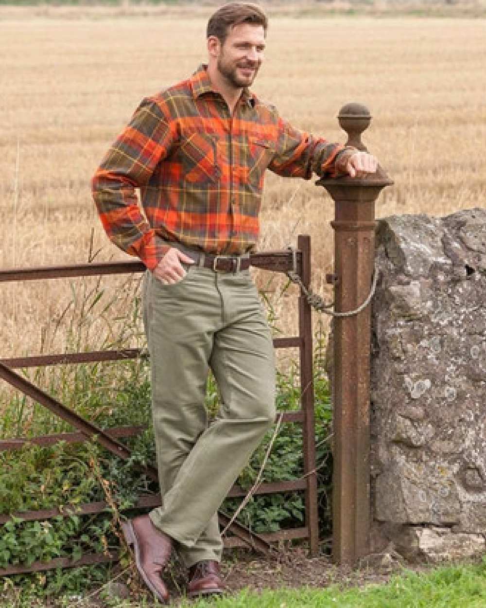 Dried Moss Coloured Hoggs of Fife Carrick Stretch Technical Moleskin Trousers on farm background 