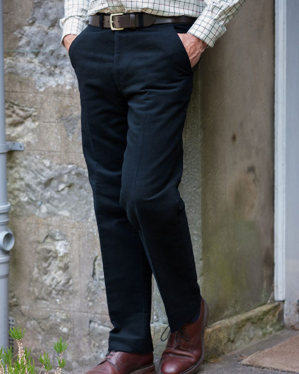 Navy Coloured Hoggs of Fife Carrick Stretch Technical Moleskin Trousers on wall background 