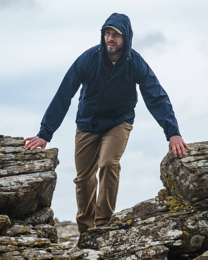 Dried Moss Coloured Hoggs of Fife Carrick Technical Stretch Moleskin Jeans on sky background 