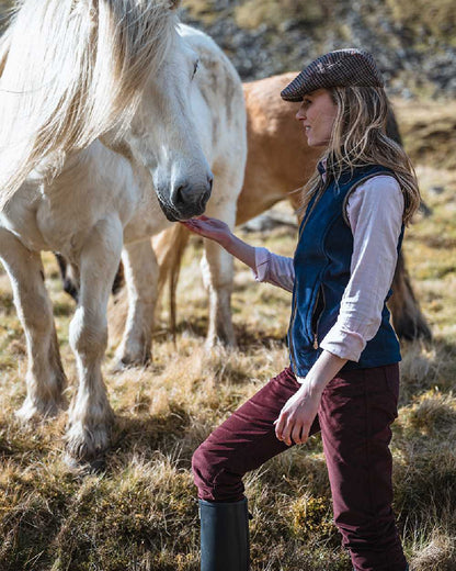 Merlot Coloured Hoggs of Fife Ceres Ladies Stretch Cord Jeans on countryside background 