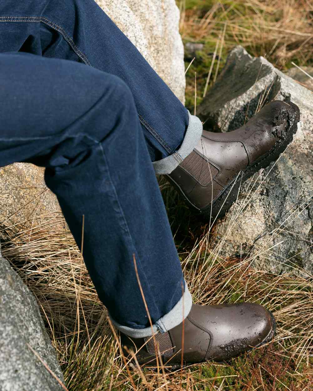 Dark Brown Coloured Hoggs of Fife Classic Safety Dealer Boot on countryside background 