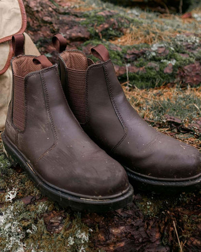 Dark Brown Coloured Hoggs of Fife Classic Safety Dealer Boot on countryside background 