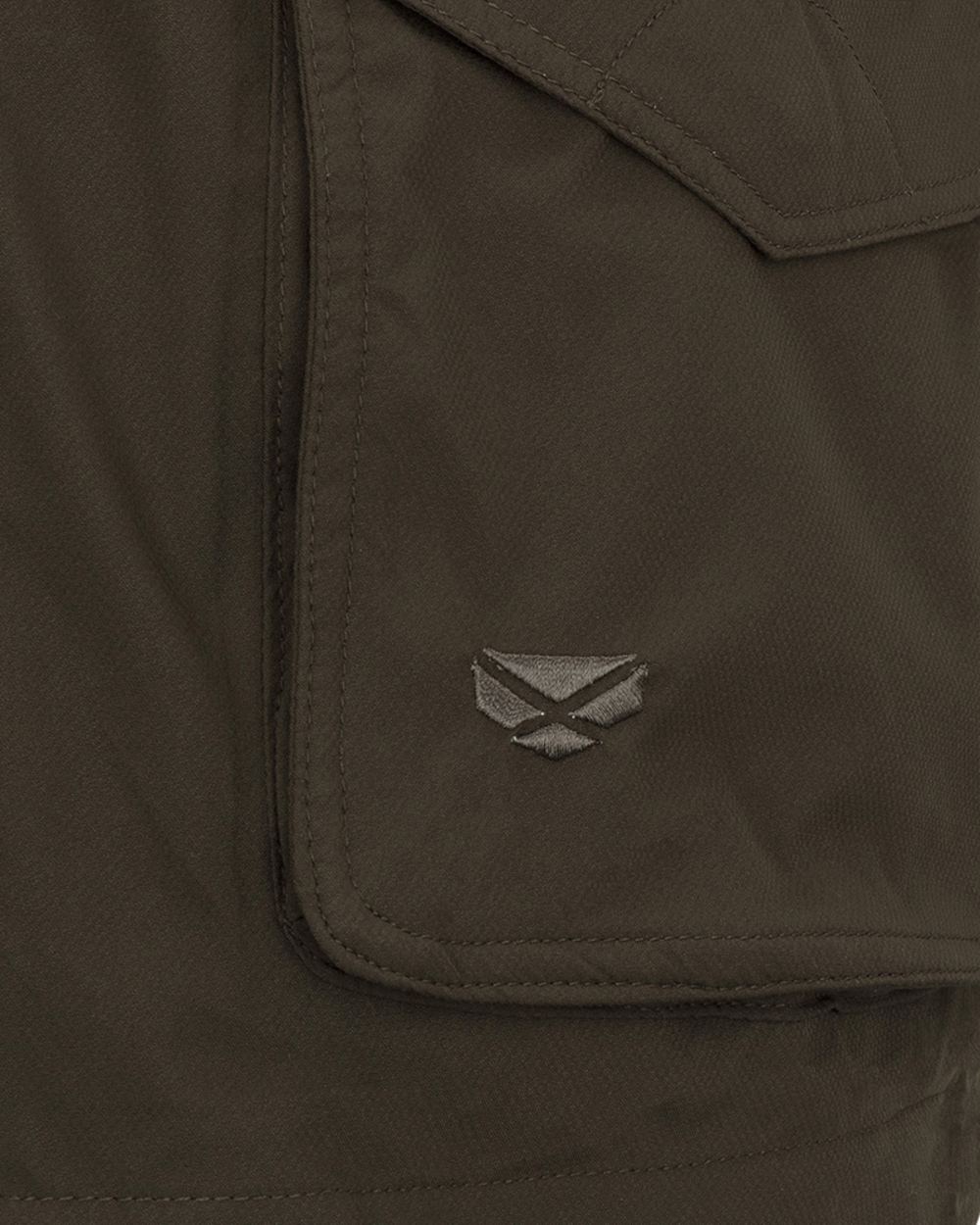 Fern Green coloured Hoggs of Fife Culloden Waterproof Field Jacket on field background 