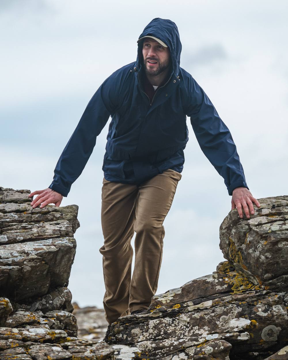 Navy Coloured Hoggs of Fife Culloden Waterproof Field Jacket on sky background 