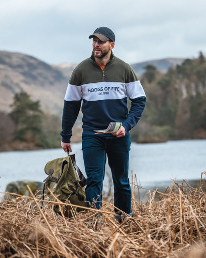 Forest White Navy Coloured Hoggs of Fife Dumfries 1888 Mens Quarter Zip Sweatshirt on lake background 