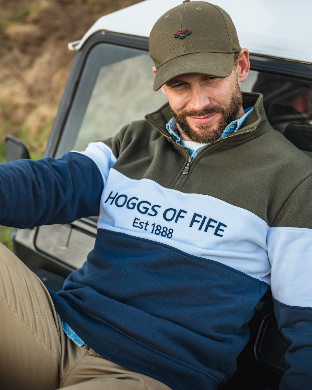 Forest White Navy Coloured Hoggs of Fife Dumfries 1888 Mens Quarter Zip Sweatshirt on car background 