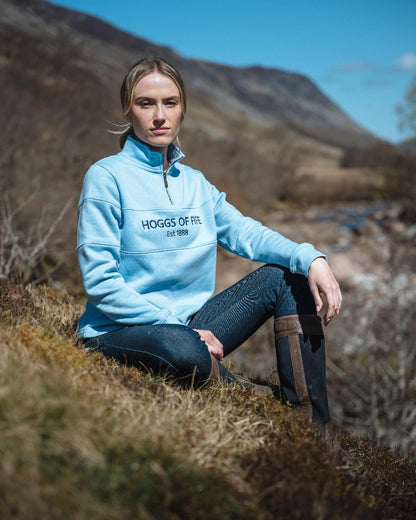 Plain Blue Coloured Hoggs of Fife Dumfries 1888 Womens Quarter Zip Sweatshirt on forest background 