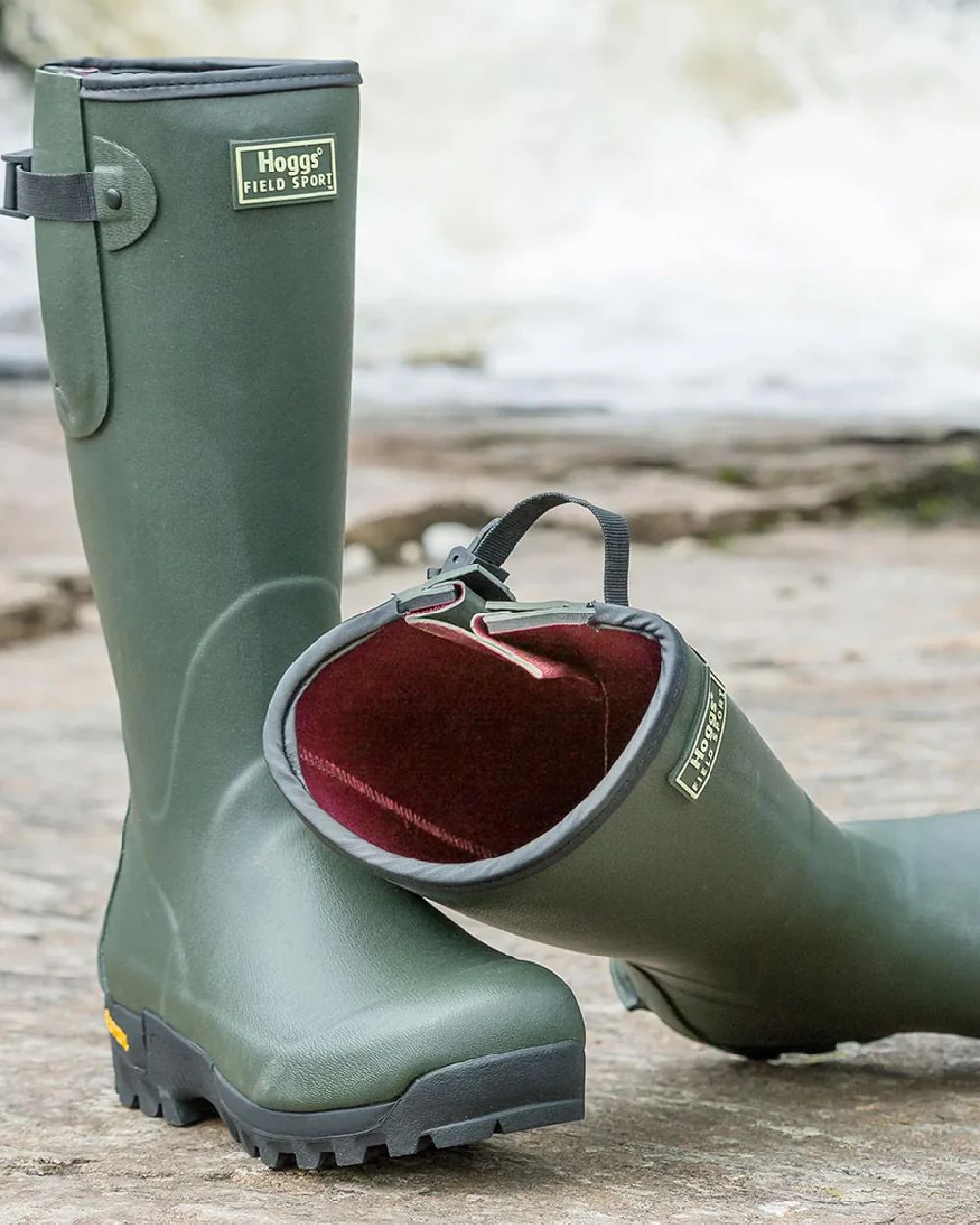 Field Green Coloured Hoggs of Fife Field Sport 365 Wellingtons on land background 