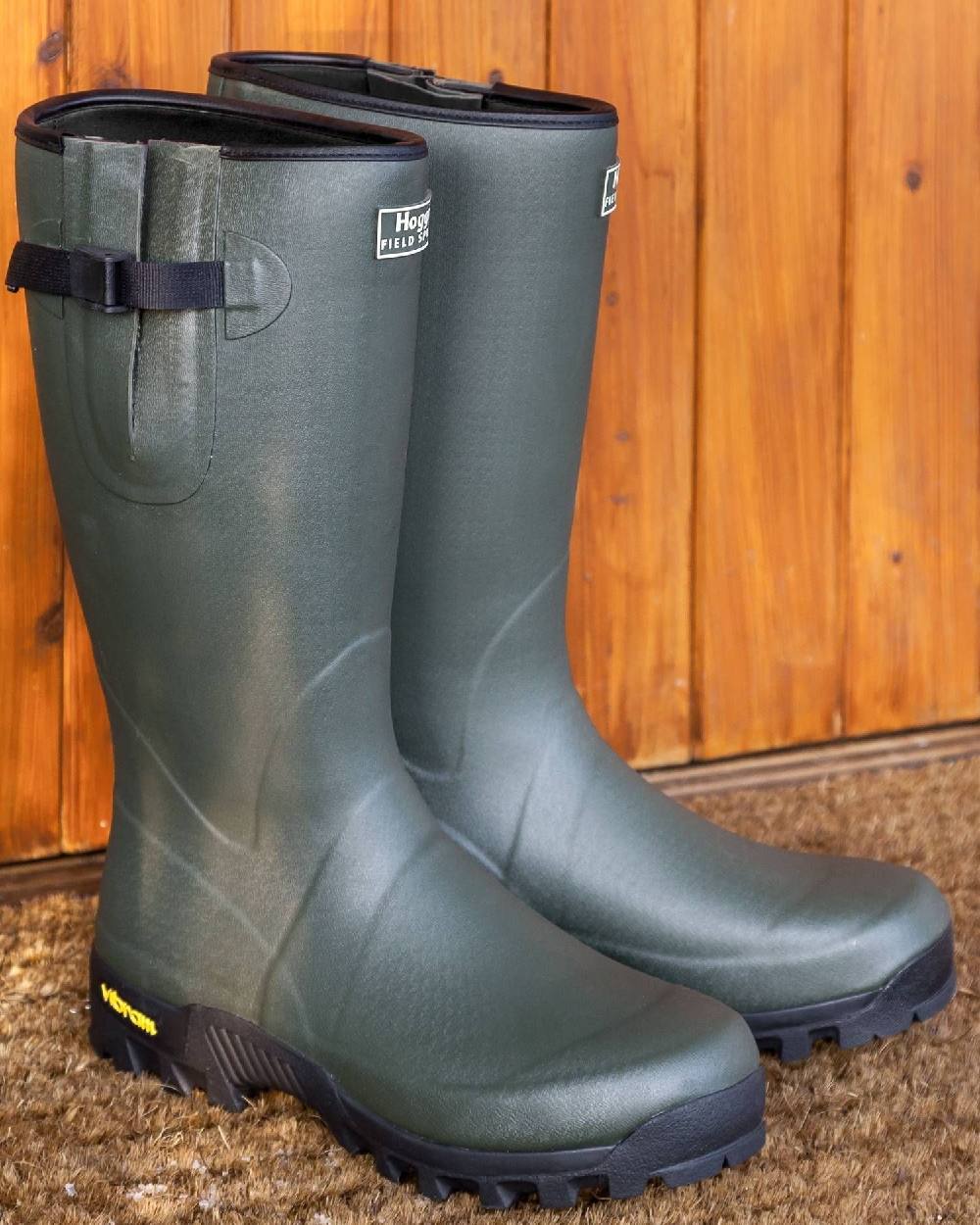 Field Green Coloured Hoggs of Fife Field Sport 365 Wellingtons on wood background 