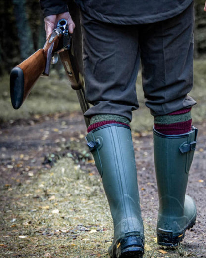 Field Green Coloured Hoggs of Fife Field Sport Neoprene Lined Wellingtons on land background 