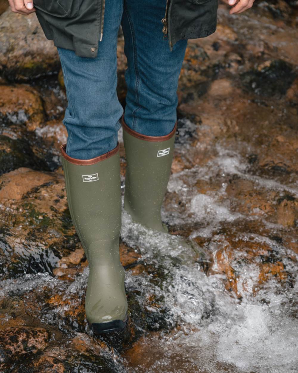 Field Green coloured Hoggs of Fife Field Sport Full Zip Wellingtons on stream background 