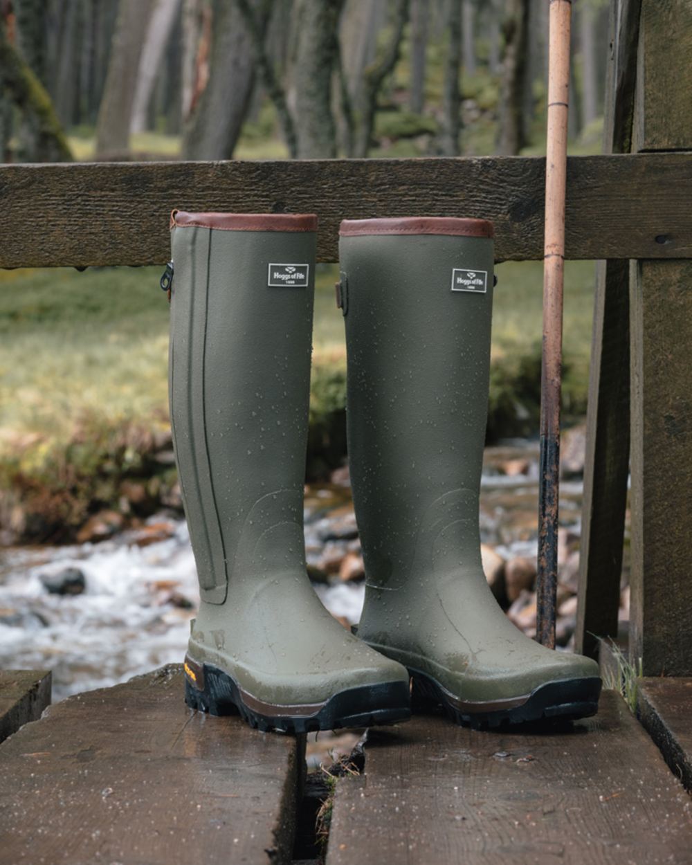 Field Green coloured Hoggs of Fife Field Sport Full Zip Wellingtons on stream background 