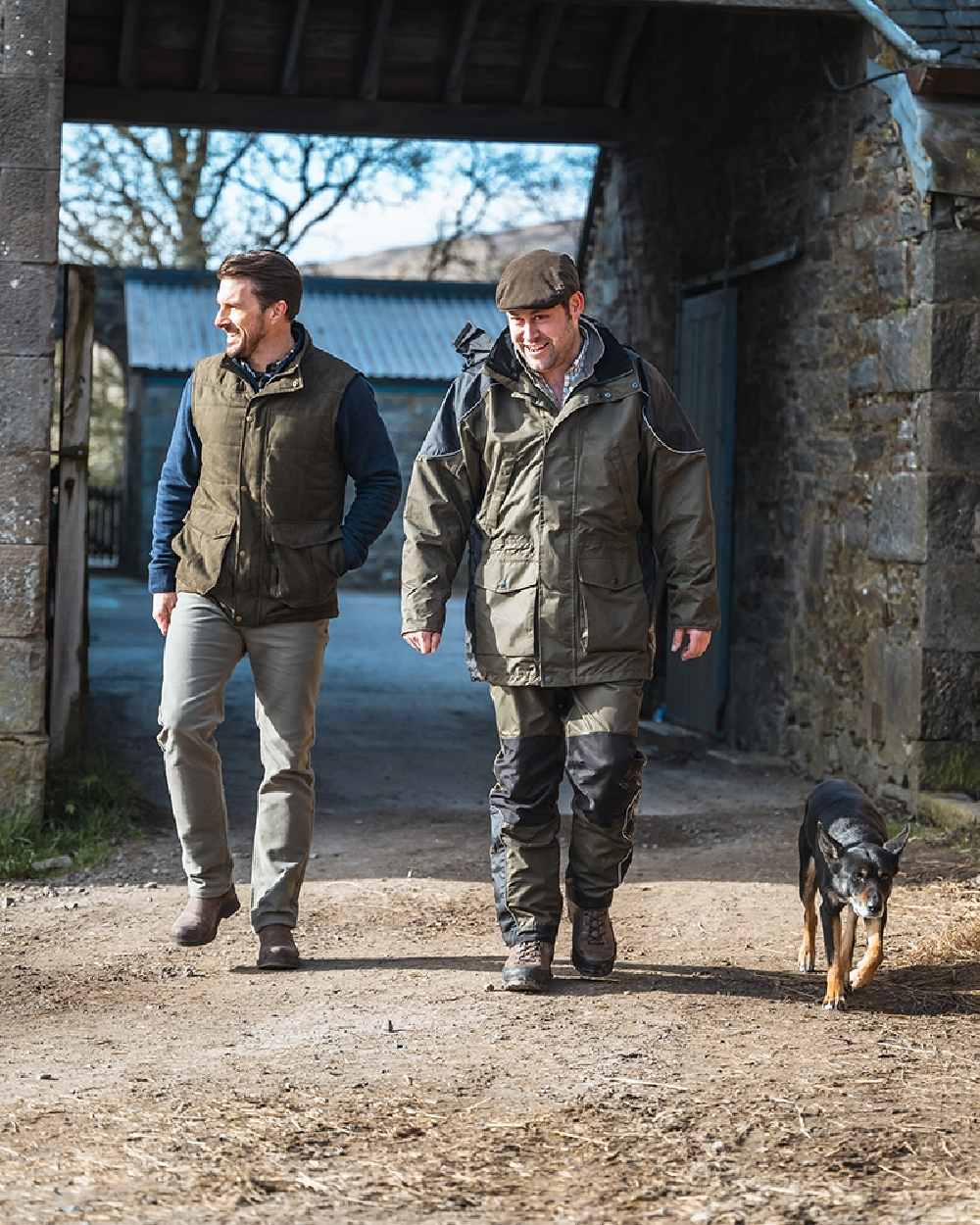 Green Coloured Hoggs of Fife Field Tech Waterproof Jacket on house background 