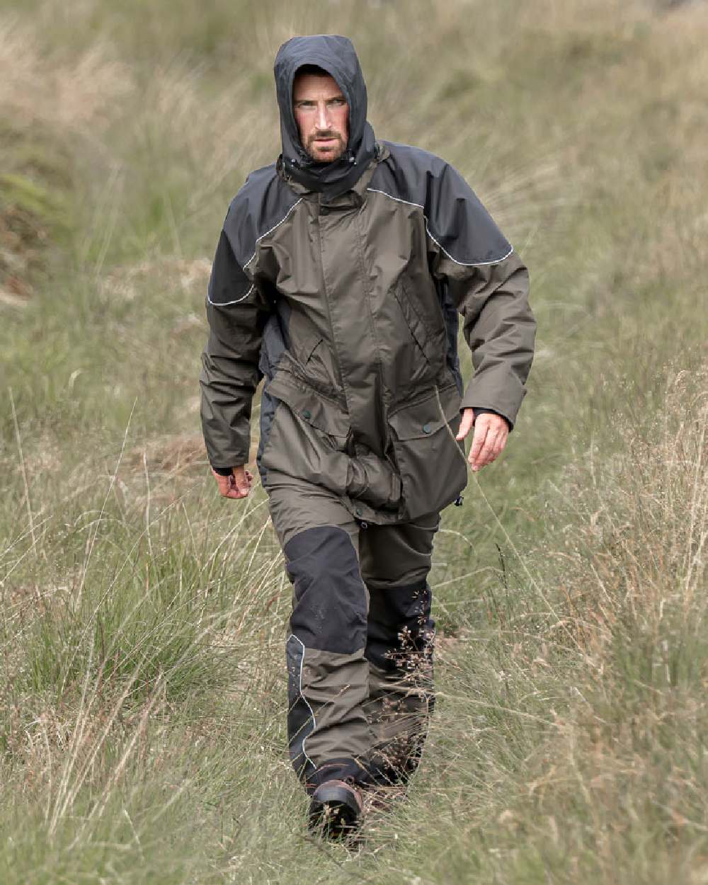 Green Coloured Hoggs of Fife Field Tech Waterproof Jacket on land background 