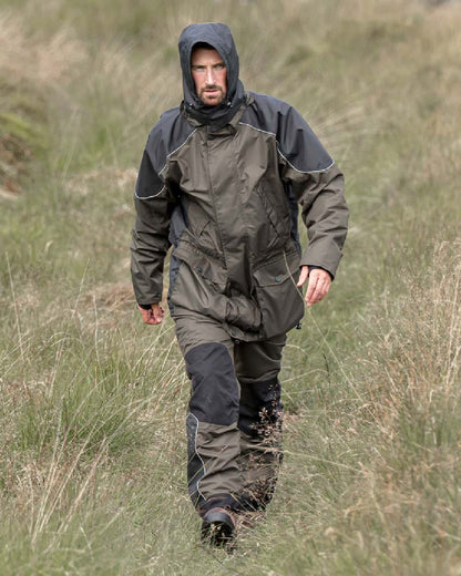 Dark Olive Coloured Hoggs of Fife Field Tech Waterproof Trousers on land background 