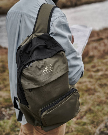 Green Black Coloured Hoggs of Fife Field &amp; Trek Backpack on blurry background 