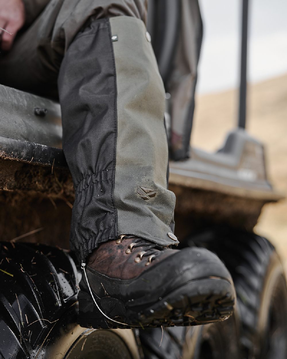 Green Black Coloured Hoggs of Fife Field &amp; Trek Gaiters on blurry background 