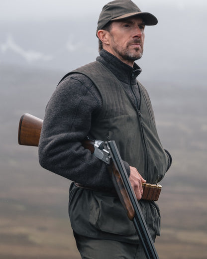 Bracken coloured Hoggs of Fife Mens Gairloch Knitted Fleece Lined Jacket on misty moorland background 