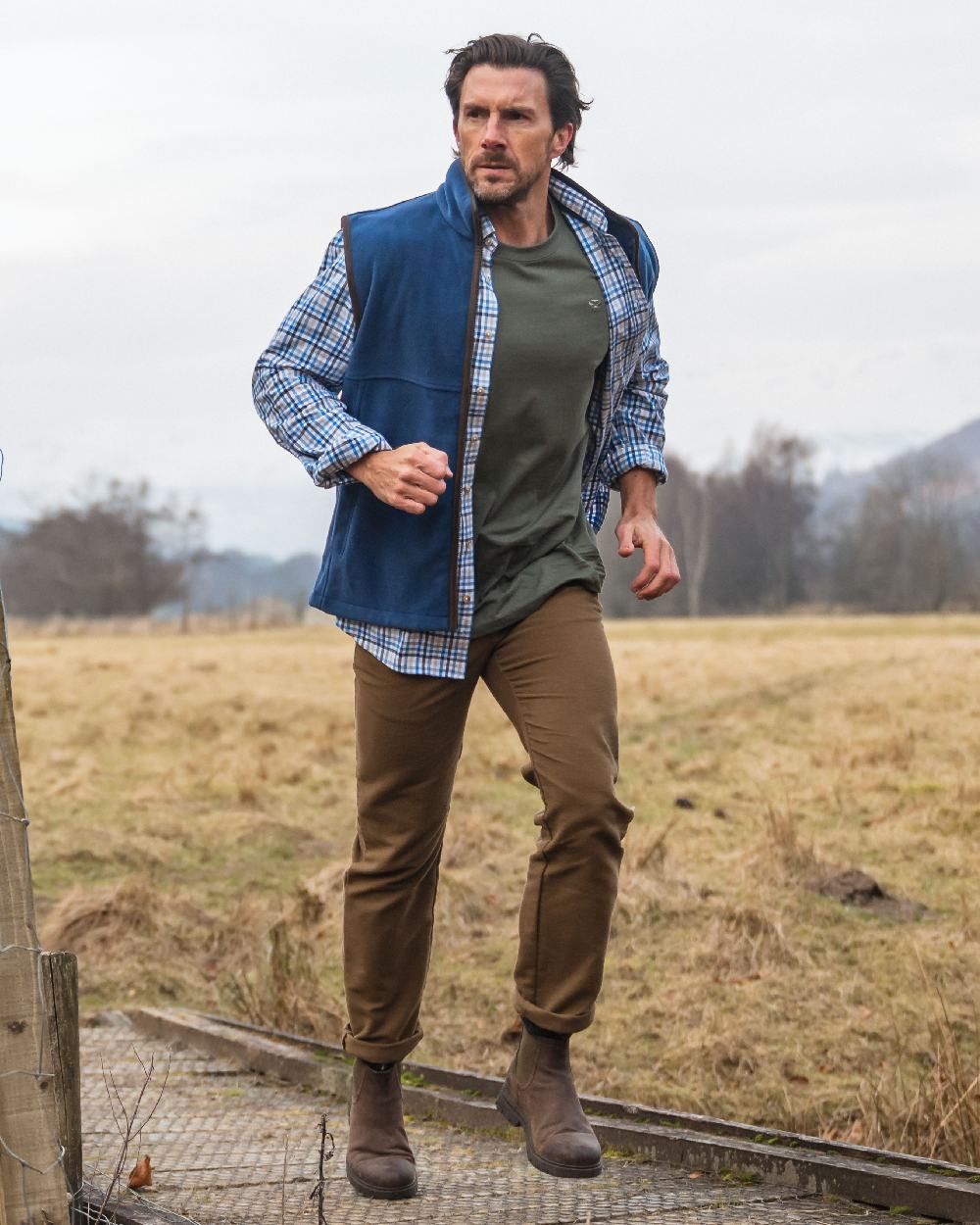 Blue Gold Check Coloured Hoggs of Fife Garvock Cotton Twill Herringbone Check Shirt on farm background 