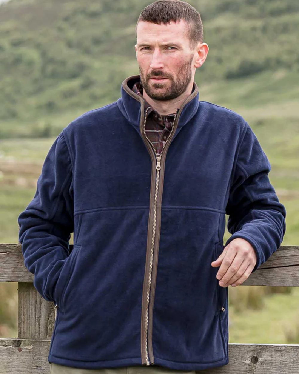 Navy Coloured Hoggs of Fife Ghillie II Padded Waterproof Fleece Jacket on mountain background 