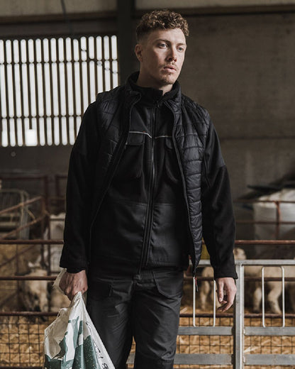 Black Coloured Hoggs of Fife Granite Bonded Fleece Jacket on barn background 