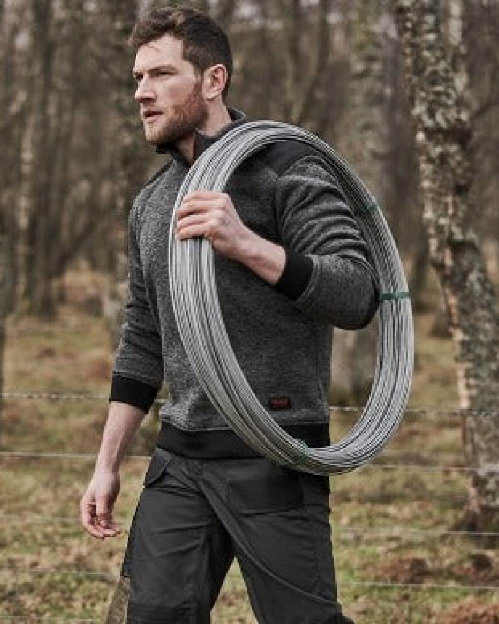 Charcoal Black Coloured Hoggs of Fife Granite II Utility Thermal Trousers on forest background 