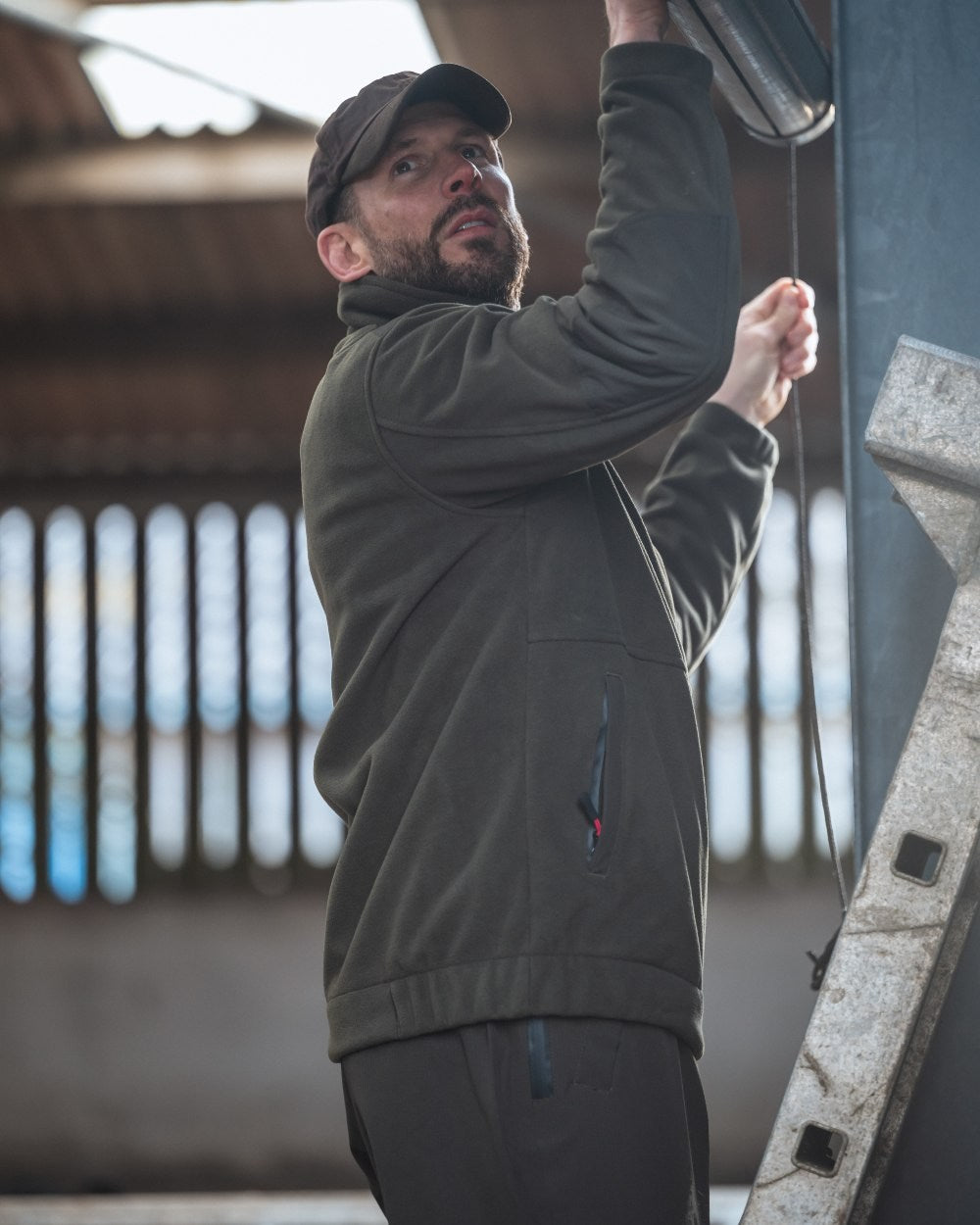 Green Coloured Hoggs of Fife Green King II 1/4 Zip Bonded Fleece on room background 